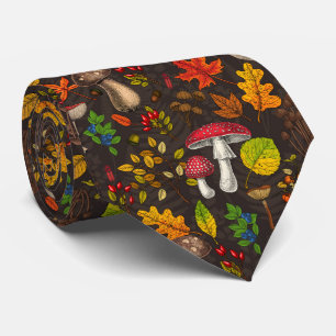 Autumn mushrooms, leaves, nuts and berries on dark tie