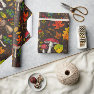 Autumn mushrooms, leaves, nuts and berries on dark wrapping paper