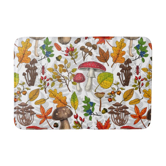 Autumn mushrooms, leaves, nuts and berries on whit bath mat (Front)