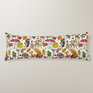 Autumn mushrooms, leaves, nuts and berries on whit body cushion