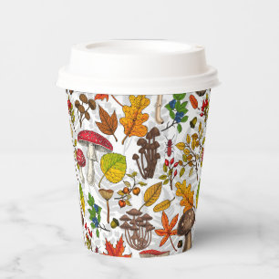 Autumn mushrooms, leaves, nuts and berries on whit paper cups