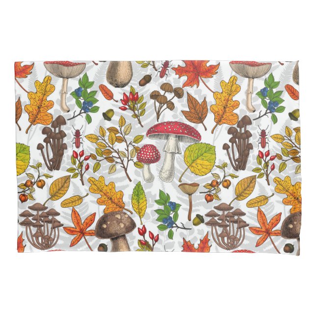 Autumn mushrooms, leaves, nuts and berries on whit pillowcase (Front-Left)