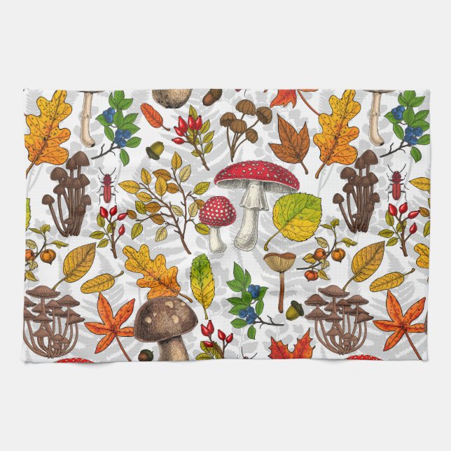Autumn mushrooms, leaves, nuts and berries on whit tea towel (Horizontal)
