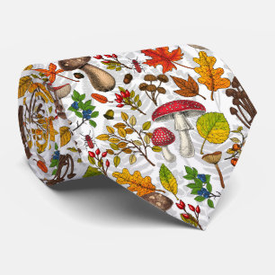 Autumn mushrooms, leaves, nuts and berries on whit tie