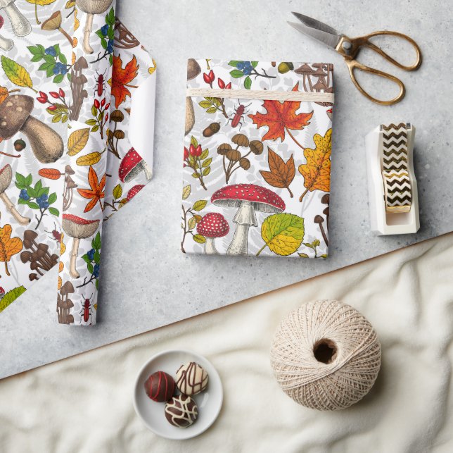 Autumn mushrooms, leaves, nuts and berries on whit wrapping paper (Crafts)