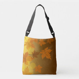 Autumn pattern with falling maple leaves and bokeh crossbody bag