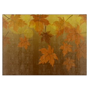 Autumn pattern with falling maple leaves and bokeh cutting board