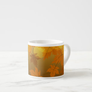 Autumn pattern with falling maple leaves and bokeh espresso cup