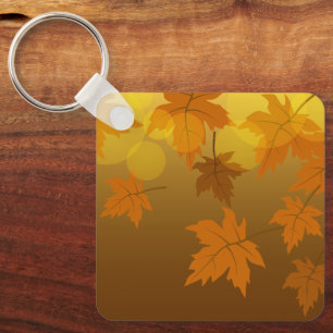 Autumn pattern with falling maple leaves and bokeh key ring