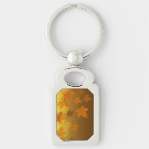 Autumn pattern with falling maple leaves and bokeh key ring