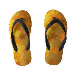 Autumn pattern with falling maple leaves and bokeh kid's thongs