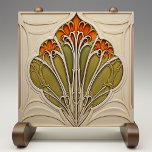 Autumn Petals Art Nouveau Ceramic Tile<br><div class="desc">Enhance your home with the exquisite beauty of the "Autumn Petals Art Nouveau Ceramic Tile, " a stunning piece that embodies the elegance and organic forms of the Art Nouveau movement. This ceramic tile, printed by Zazzle, features a detailed design of stylised petals in warm shades of orange and green,...</div>