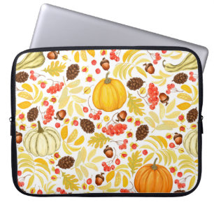 Autumn seamless background with pumpkins, acorns, laptop sleeve