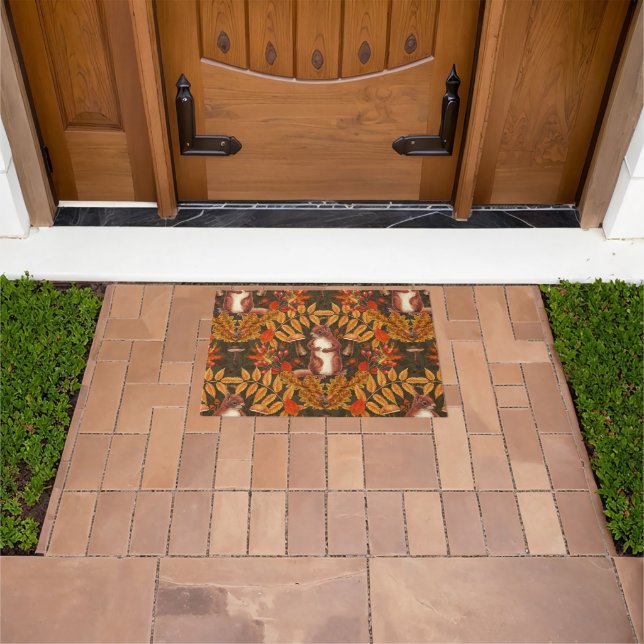 Autumn squirrel on dark brown doormat (Outdoor)
