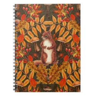 Autumn squirrel on dark brown notebook