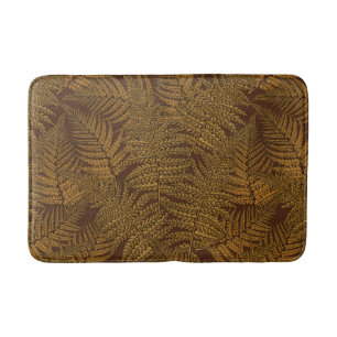 Autumnal fern on brown bath mat