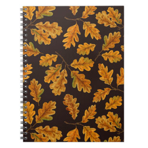 Autumnal oak leaves on dark brown notebook