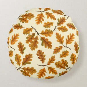 Autumnal oak leaves on off white round cushion