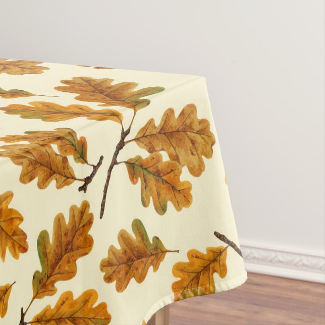 Autumnal oak leaves on off white tablecloth (In Situ)