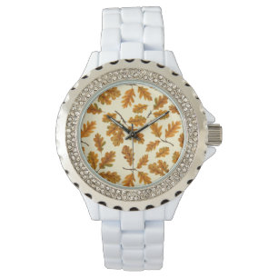Autumnal oak leaves on off white watch