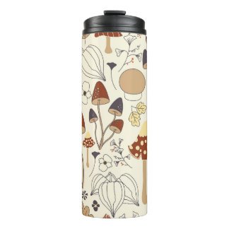 Autumnal seamless pattern with mushrooms, flowers, thermal tumbler