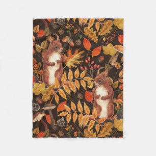Autumnal squirrels and flora on dark brown fleece blanket