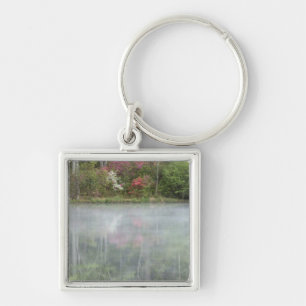 Azaleas relfecting in a pond during early key ring
