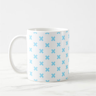 Baby blue cross stitches on white coffee mug