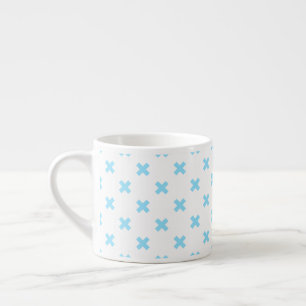 Baby blue cross stitches on white espresso cup