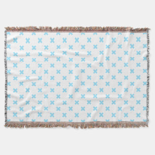 Baby blue cross stitches on white throw blanket