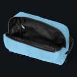 Baby Blue Sky Solid Colour Dopp Kit<br><div class="desc">Toiletries Dopp Kit Tote Bag all over print style over the shoulder style fashion statement accessory printed with Baby Blue Sky Solid Colour graphic art design illustration and select products collection by TheFabricSeal print on demand shop at Zazzle.com #ZazzleMade https://www.zazzle.com/store/thefabricseal TheFabricSeal©️Original. Baby blue is a lighter blue hue tone plus...</div>