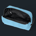 Baby Blue Sky Solid Colour Dopp Kit<br><div class="desc">Toiletries Dopp Kit Tote Bag all over print style over the shoulder style fashion statement accessory printed with Baby Blue Sky Solid Colour graphic art design illustration and select products collection by TheFabricSeal print on demand shop at Zazzle.com #ZazzleMade https://www.zazzle.com/store/thefabricseal TheFabricSeal©️Original. Baby blue is a lighter blue hue tone plus...</div>