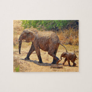 Baby elephant following its mother, South Africa Jigsaw Puzzle