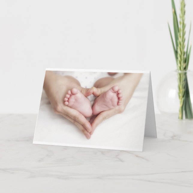 Baby feet in mother hands card (Front)