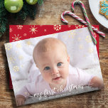 Baby First Christmas Photo Script Gold Snowflake Holiday Card<br><div class="desc">“My First Christmas.” A playful visual of champagne gold snowflakes and handwritten script typography, overlaying the photo of your choice, help you usher in Christmas and New Year. On the back, additional champagne gold snowflakes overlay a red background. Feel the warmth and joy of the holiday season whenever you send...</div>