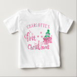 Baby First Christmas Pink Snowman and Snowflakes T-Shirt<br><div class="desc">Personalised First Christmas T-Shirt with a cute snowman and pink, candy cane typography. The wording reads "[your name's] first Christmas" and the template is set up for you to add baby's name. The design features a cartoon snowman with beautifully gift wrapped xmas presents, snowflakes and stars. Lovely top for a...</div>