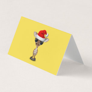 Baby Giraffe Wearing a Santa Hat