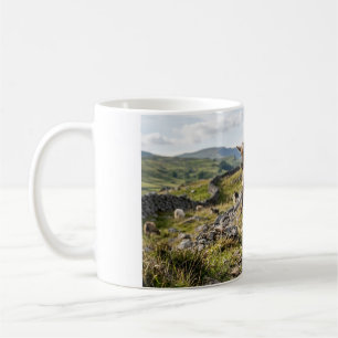 Baby Goat Jumping in Rocky Pasture Coffee Mug