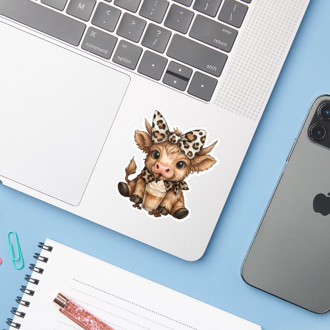 Baby Highland Cow drinking latte  (Laptop w/ iPhone)