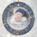 Babys 1st Christmas Photo Gold Foliage Navy Blue Ceramic Ornament<br><div class="desc">Celebrate baby's first Christmas with this beautiful keepsake ornament. Easily replace the sample image with your own favourite photo and customise it with baby's name in navy blue script font and the year below. A white gradient screen helps make the text pop. The photo is set off by an elegant...</div>
