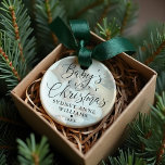 Baby's First Christmas Custom Name Photo Keepsake Ornament<br><div class="desc">Special keepsake ornament to commemorate baby's first Christmas. Design features a simple minimal design with "Baby's First Christmas" displayed in elegant script and serif text pairing with a photo displayed in the background with a white transparent overlay. Personalise with the baby's name and the year. The reverse side features the...</div>