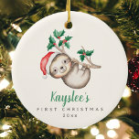 Babys First Christmas Custom Name Sloth Ornament<br><div class="desc">Baby's First Christmas Custom Name Sloth Ceramic Ornament — The precious personalised newborn's xmas ornament template features an adorable watercolor holiday sloth, hanging from a holly branch and wearing a santa hat. The text boxes allow for easy customisation of a baby's name in a handwritten bold muted green calligraphy script...</div>