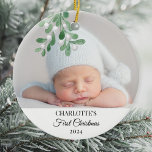 Baby's First Christmas Mistletoe Photo Ceramic Ornament<br><div class="desc">This cute Baby's First Christmas Ornament is decorated with watercolor mistletoe. Easily customisable with your baby's photo, name, and year. Use the Design Tool to change the text size, style, or colour. Because we create our artwork you won't find this exact image from other designers. Original Watercolor © Michele Davies....</div>