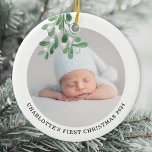 Baby's First Christmas Photo Ceramic Ornament<br><div class="desc">This Baby's First Christmas Ornament is decorated with watercolor mistletoe.
Easily customizable with your baby's photo,  name,  and year.
Use the Design Tool to change the text size,  style,  or color.
Original Watercolor © Michele Davies.</div>