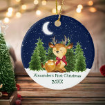 Baby's First Christmas Watercolor Deer Red Bow Ceramic Ornament<br><div class="desc">Baby's First Christmas Watercolor Woodland Animal Forest Deer Pine Trees Moon,  Starry Sky and Snow Ceramic Ornament. Includes Baby Deer with a Red Bow and forest greenery. Add Name.</div>