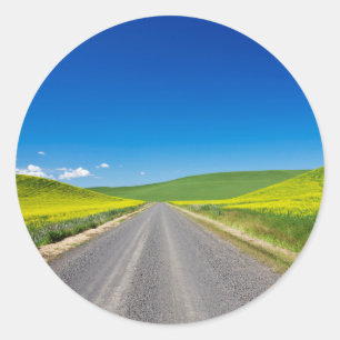 Backcountry road through Spring Canola Fields Classic Round Sticker