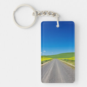 Backcountry road through Spring Canola Fields Key Ring