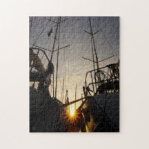 Backlight on 2 sailboats in the harbor.
