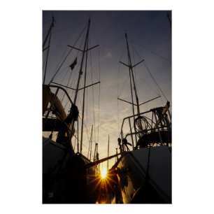 Backlight on 2 sailboats in the harbor. poster