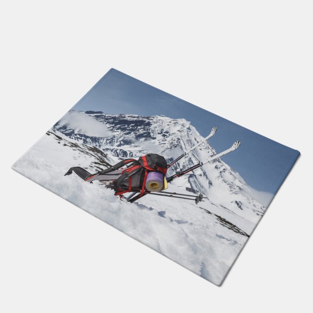 Backpack and skis on snow on background volcano doormat (Angled)